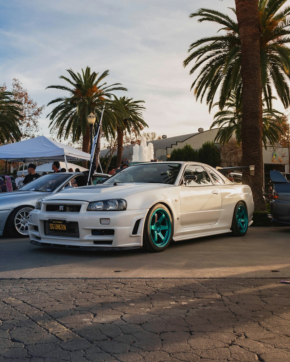 white bmw m 3 coupe parked on gray concrete pavement during daytime