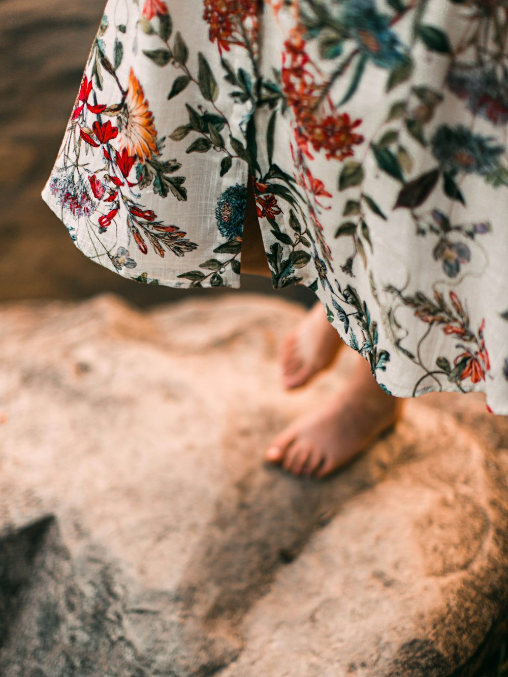 person in white red and blue floral pants