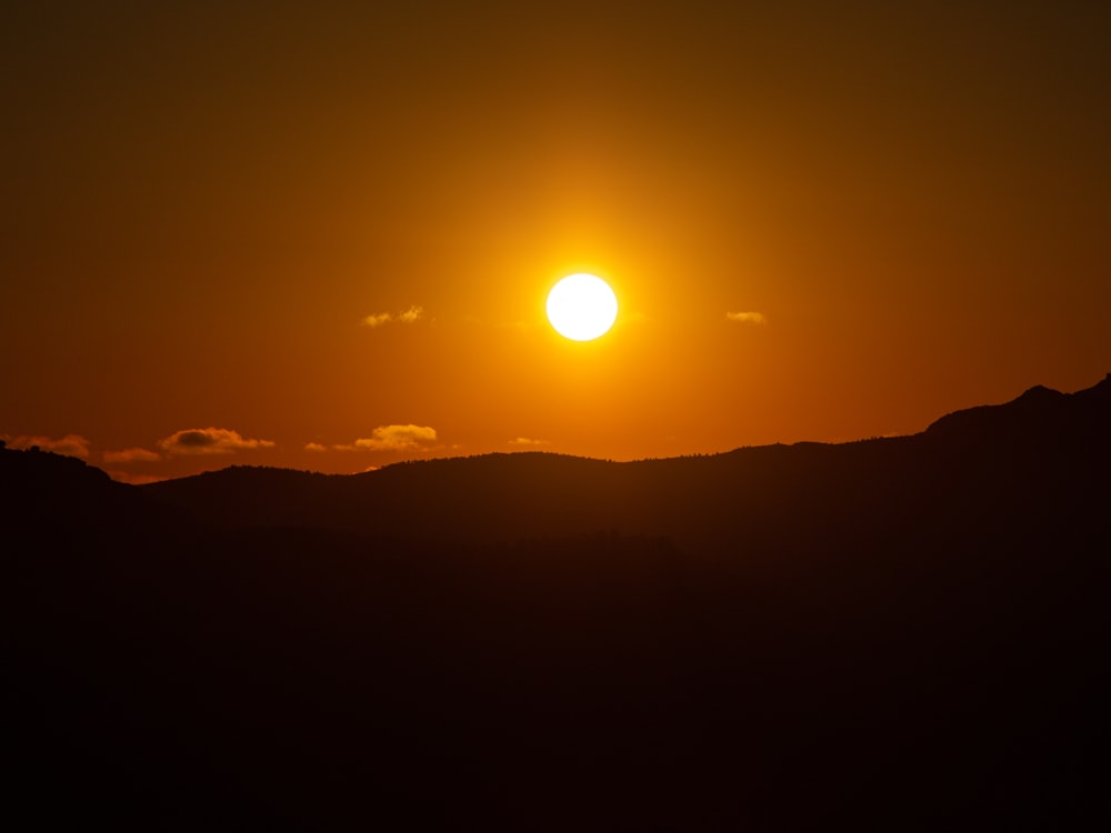 sun setting over the mountains