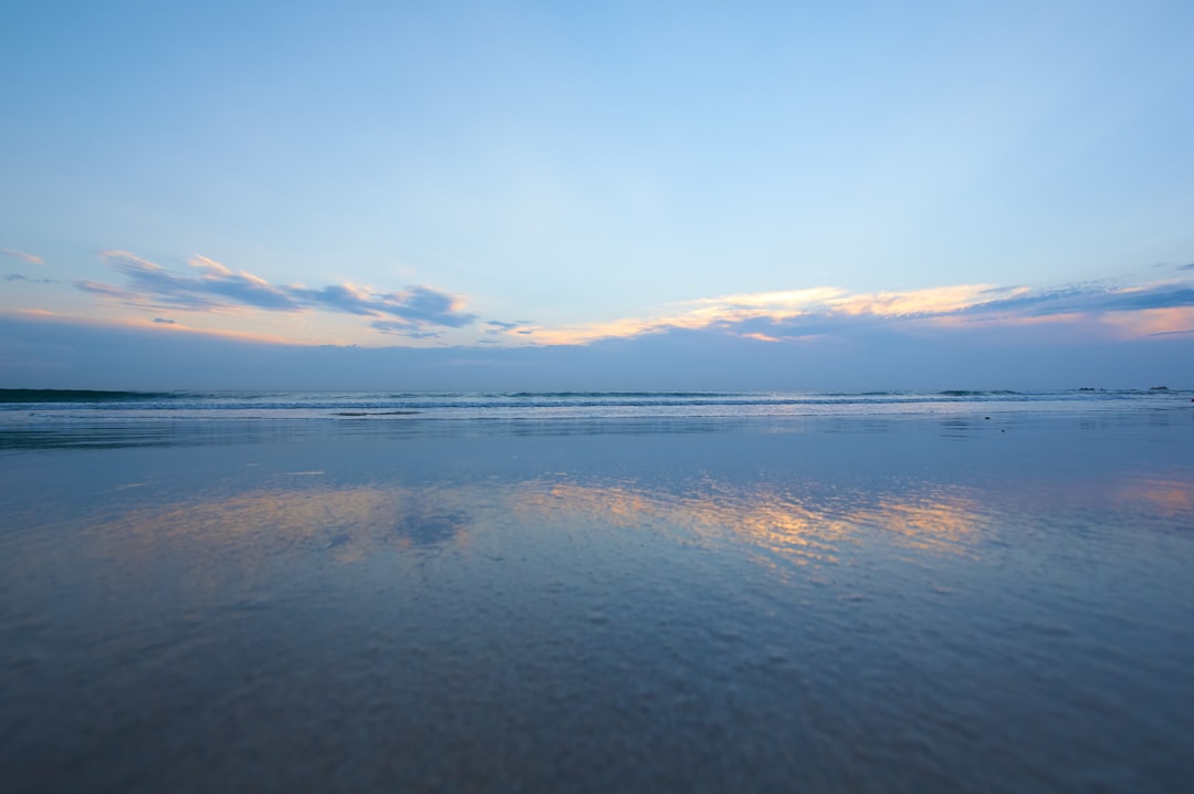 body of water under blue sky during daytime