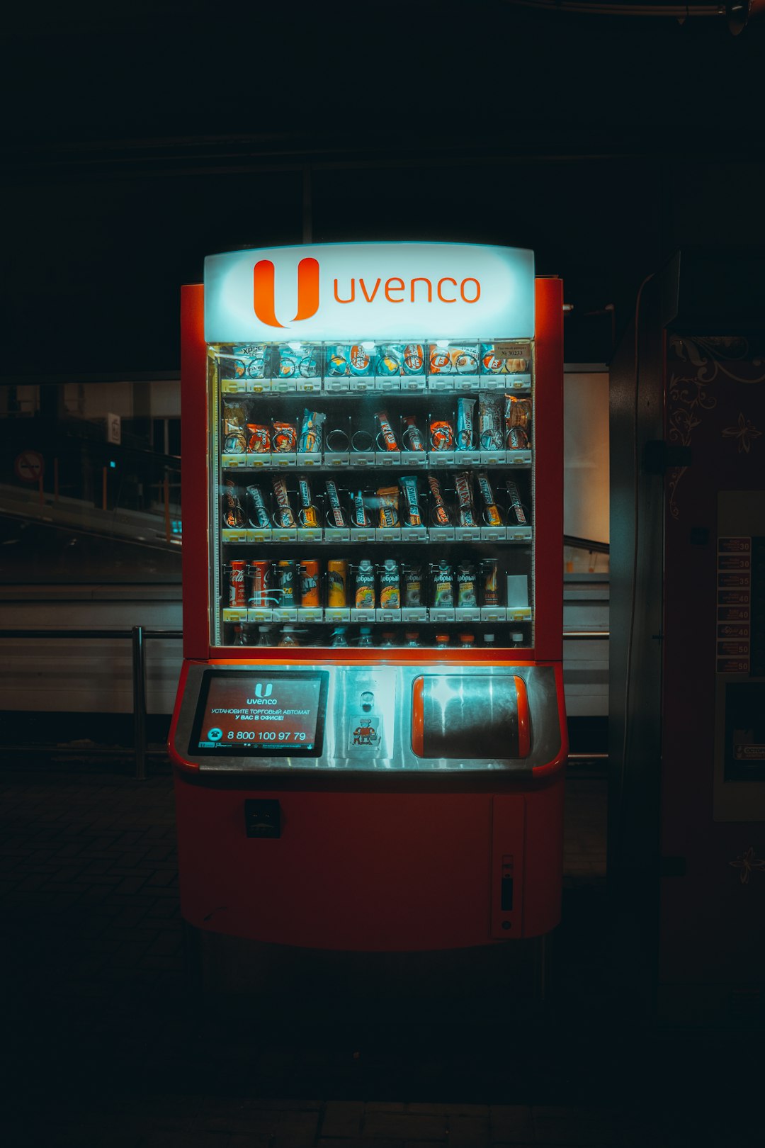 red and white coca cola vending machine