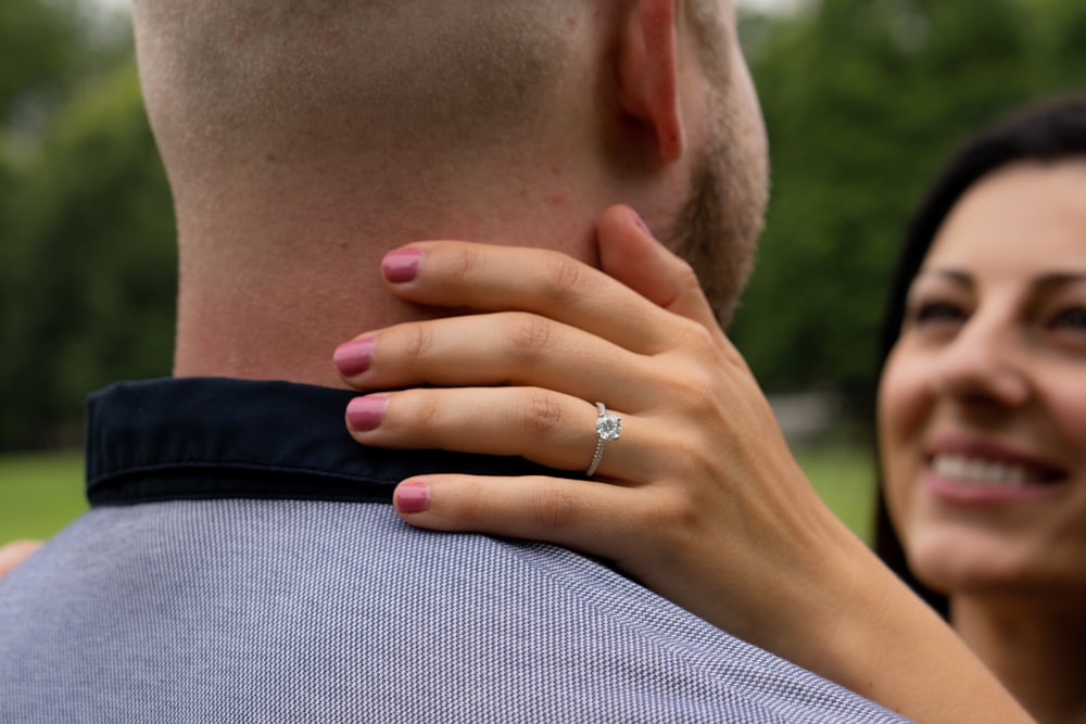 man in black shirt wearing silver ring