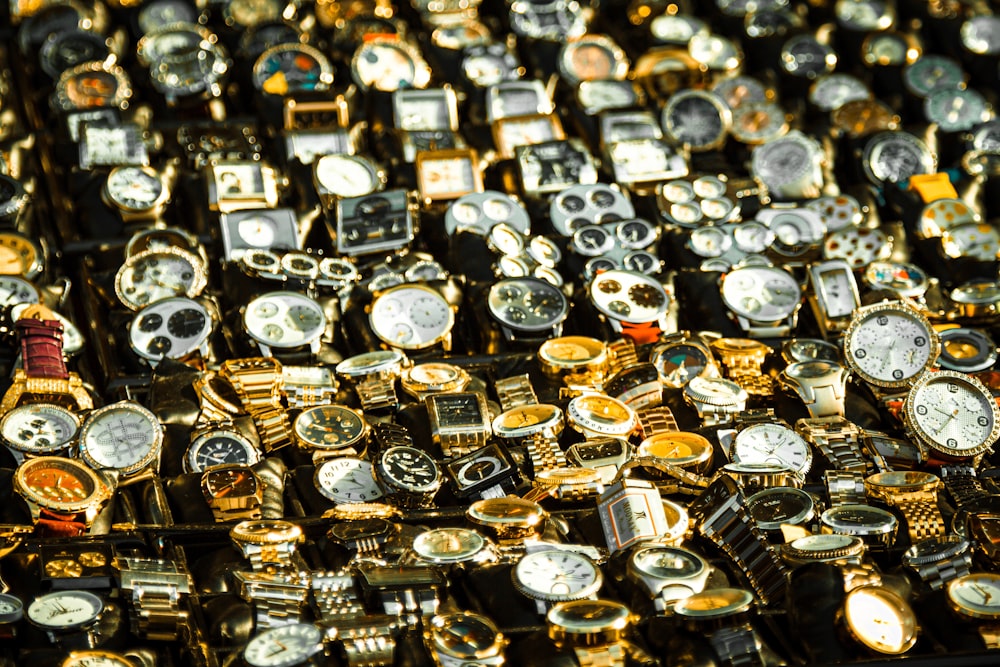 silver and gold bracelet on black surface