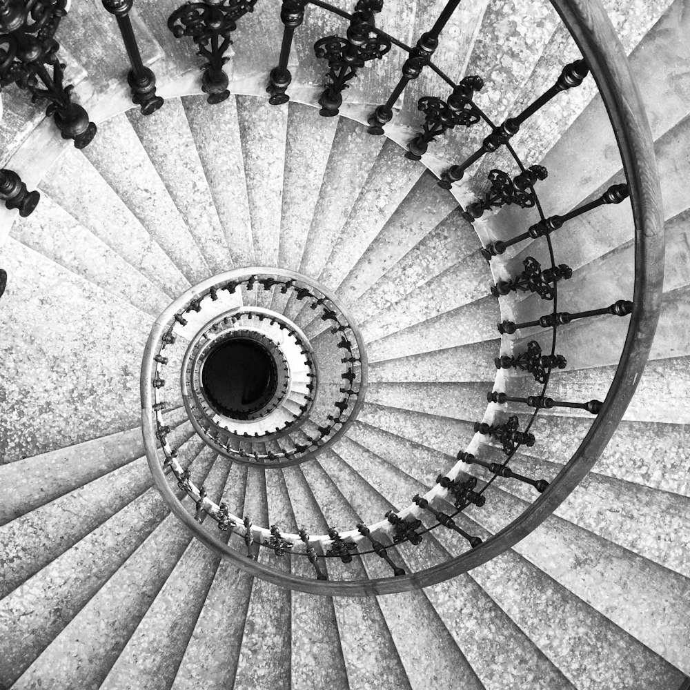 white spiral staircase with black metal railings