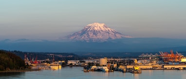 white and brown concrete building near mountain during daytime