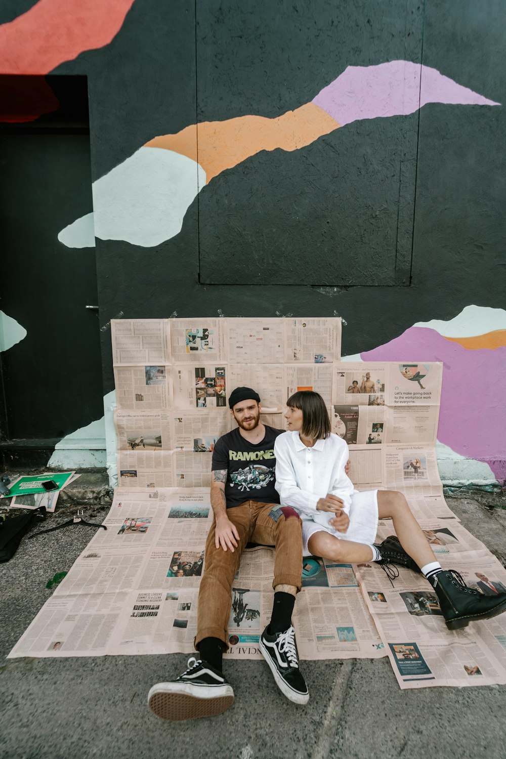 woman in white t-shirt sitting on white and brown cardboard box