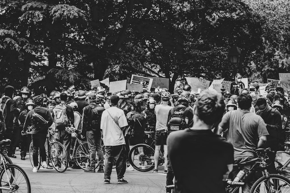 grayscale photo of people walking on street