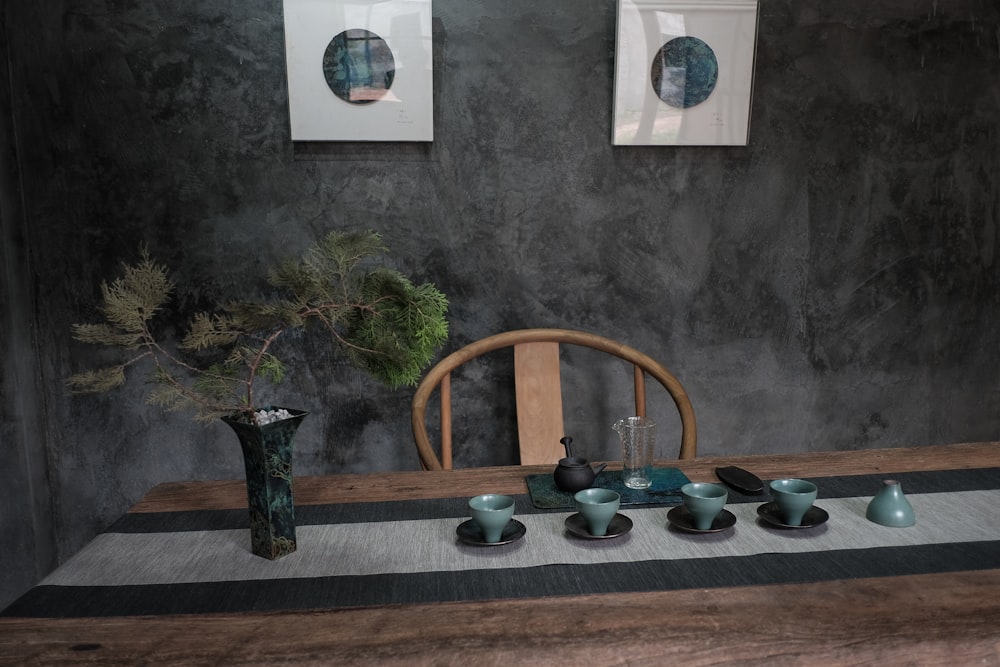 blue and brown ceramic bowls on brown wooden shelf