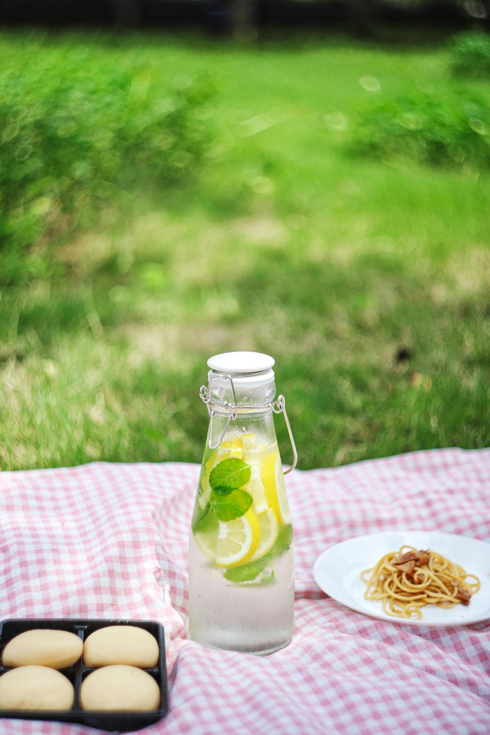 clear glass jar on pink and white table cloth