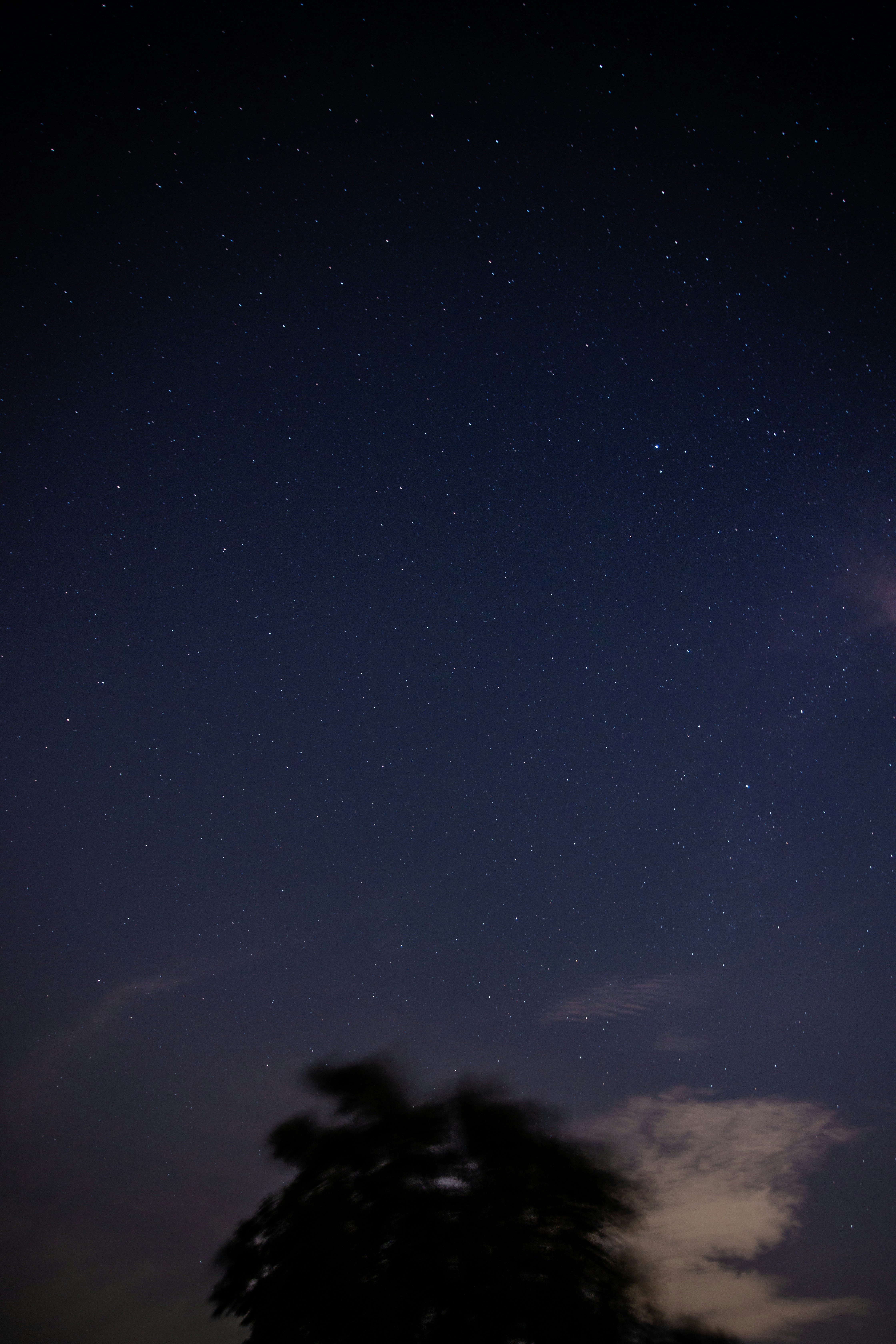 blue sky with white clouds during night time