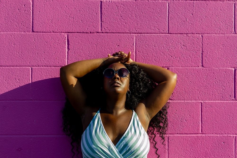 woman in white tank top wearing black sunglasses