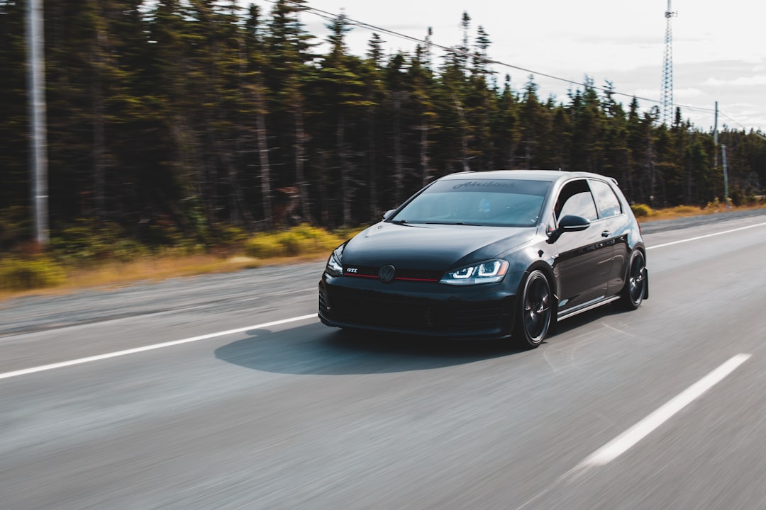 black sedan on road during daytime