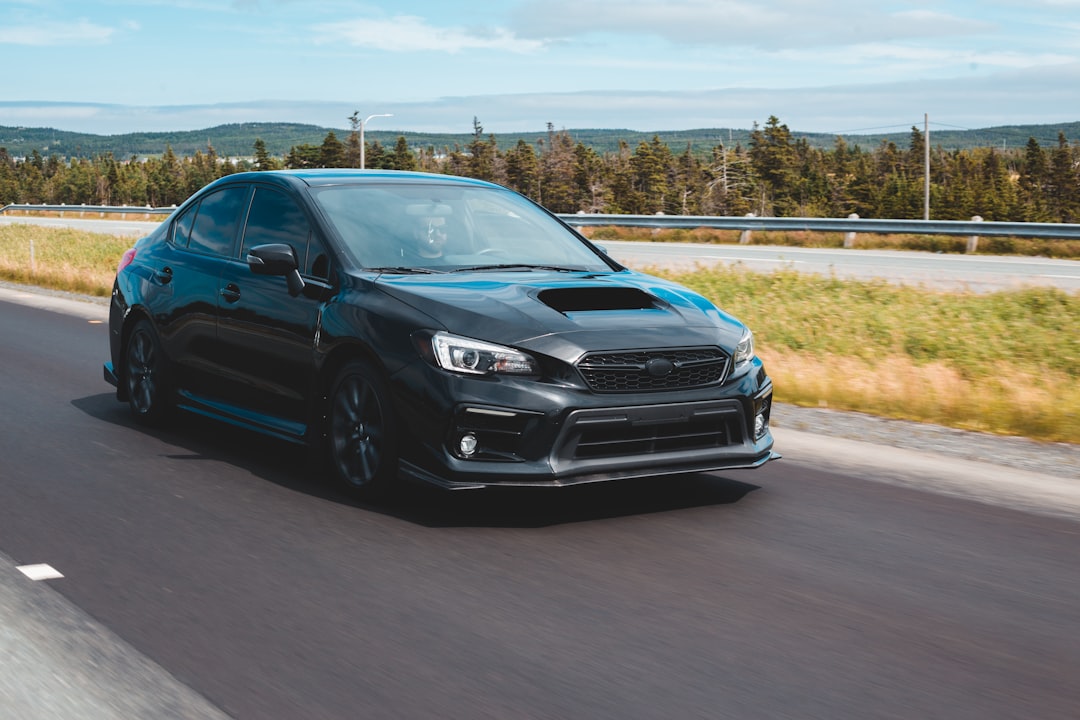 black honda car on road during daytime