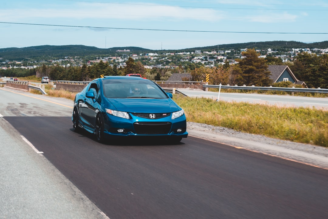 blue bmw m 3 on road during daytime