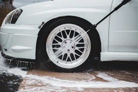 white car with black wheel