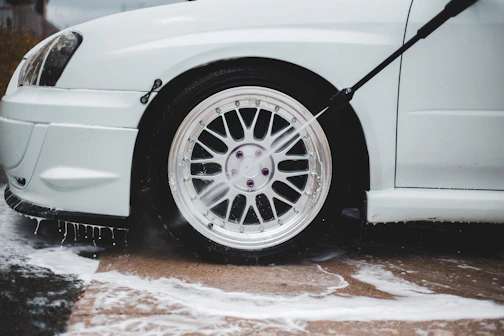 white car with black wheel