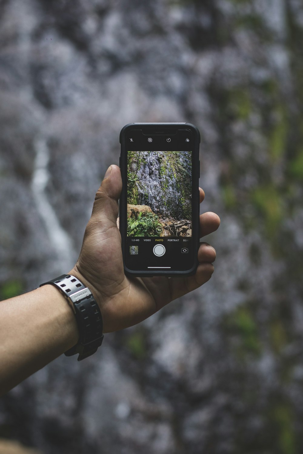 person holding black iphone 4