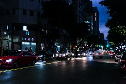 cars on road during night time in Taipei City Taiwan