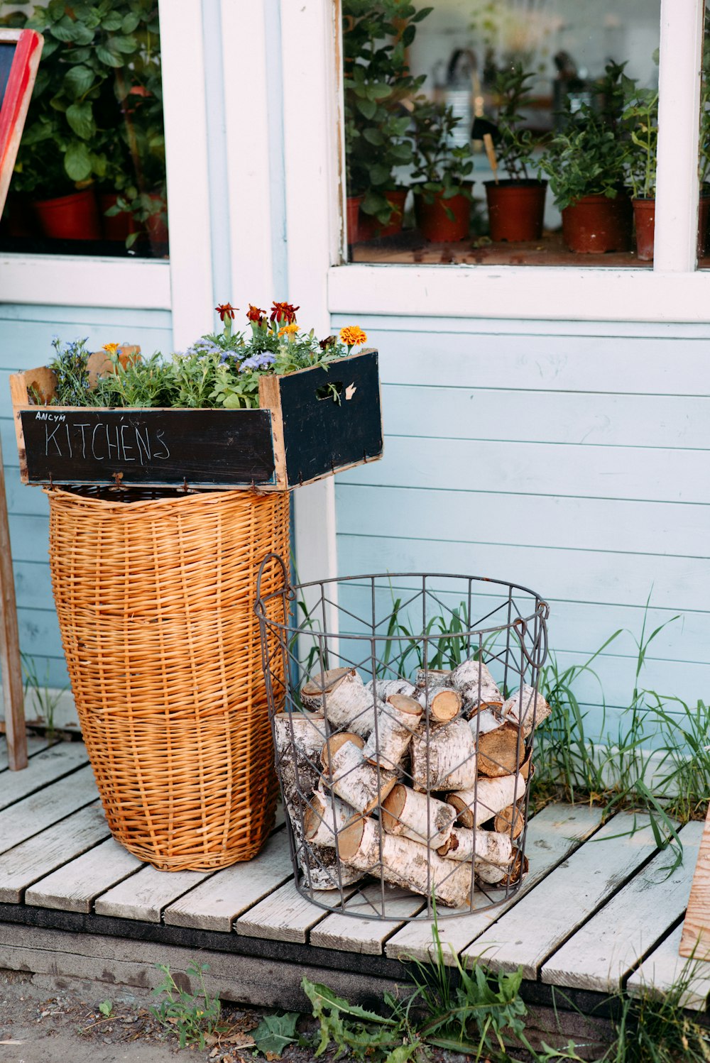 brown woven basket with green plants