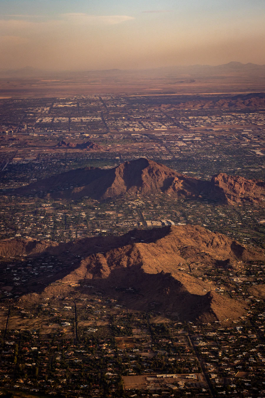 Aerial view of Scottsdale and Paradise Valley neighborhoods with mountains