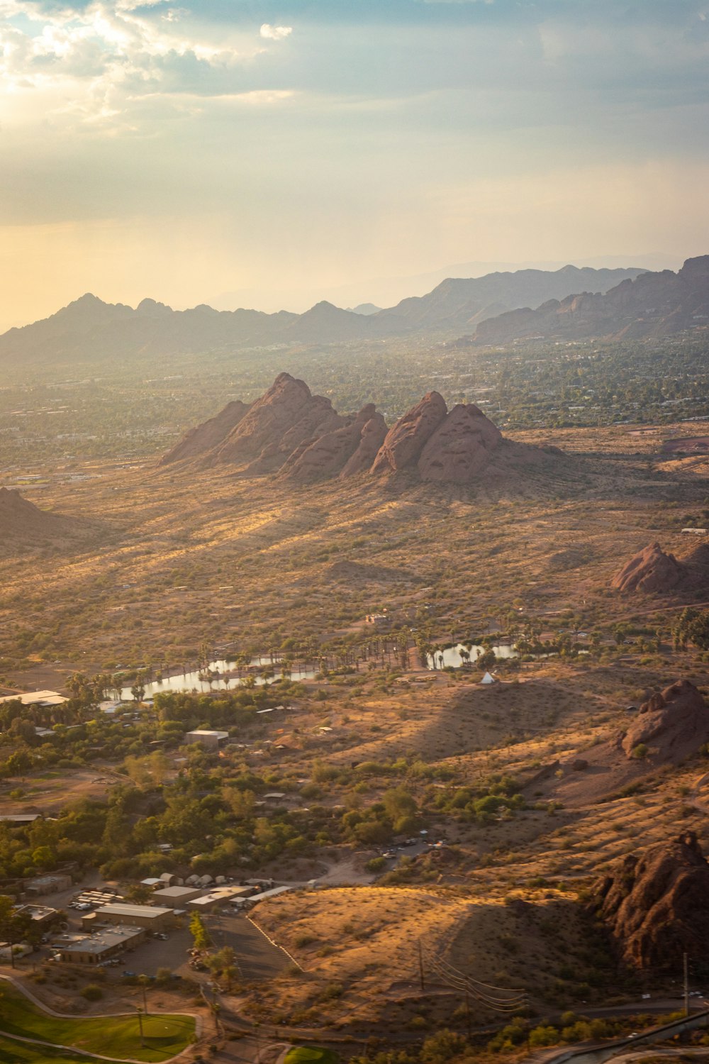 aerial view of city near brown mountains during daytime