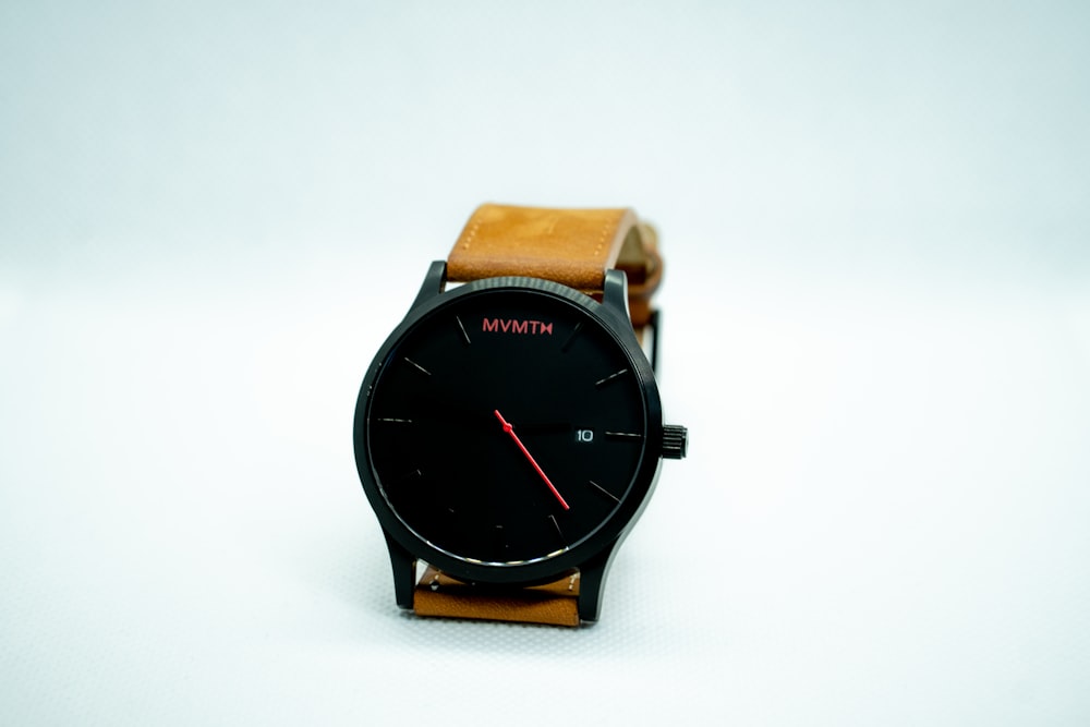 brown leather strap black round analog watch
