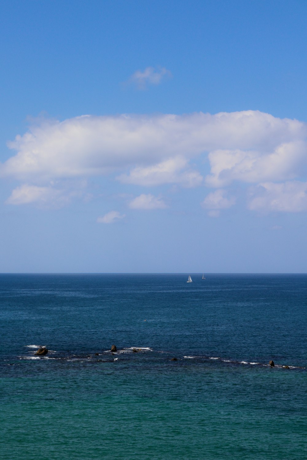 white clouds over the sea