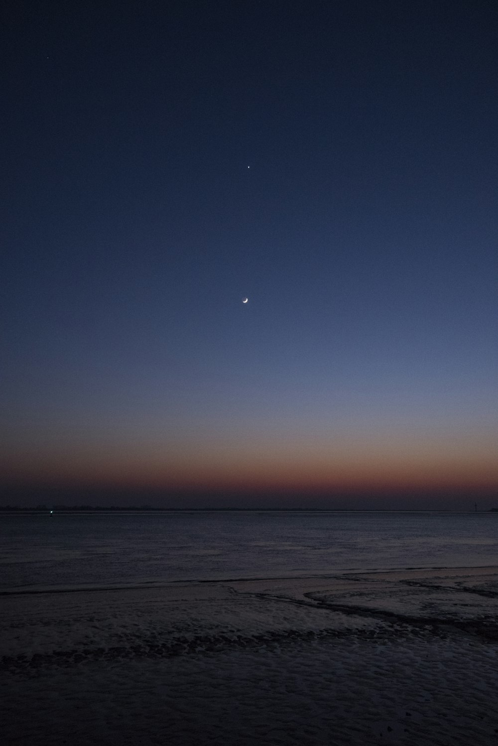 body of water during sunset