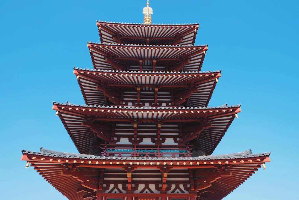 brown wooden tower under blue sky during daytime