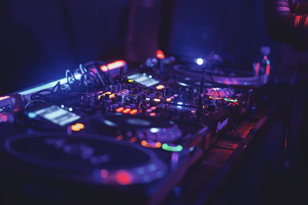 A behind-the-scenes view of DJ Kal setting up his gear before a live show.