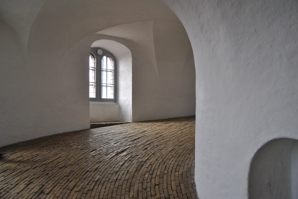 white concrete building with brown wooden window