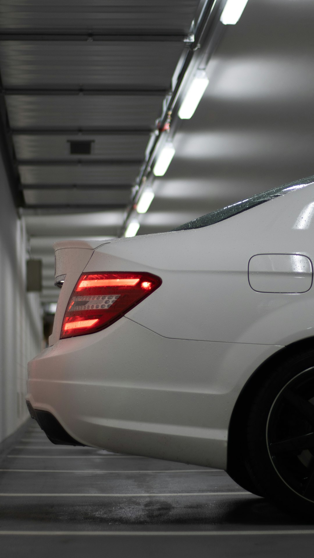 silver car with red and white sticker