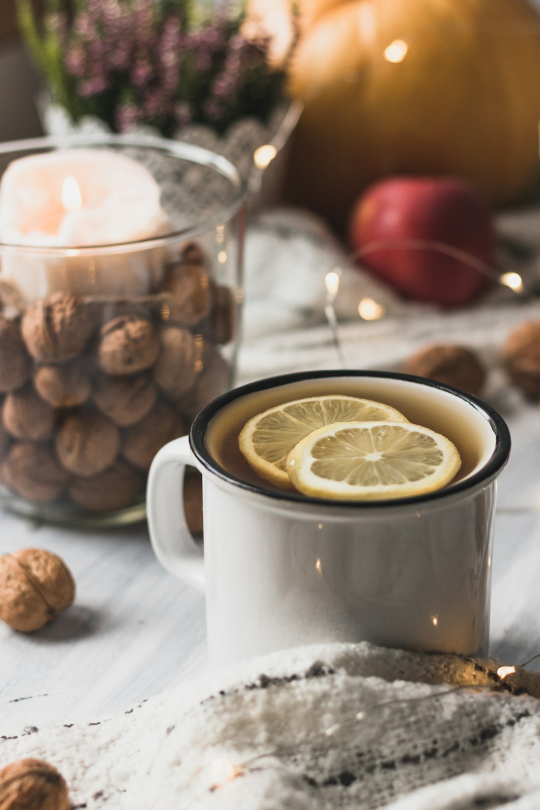 white ceramic mug with sliced lemon