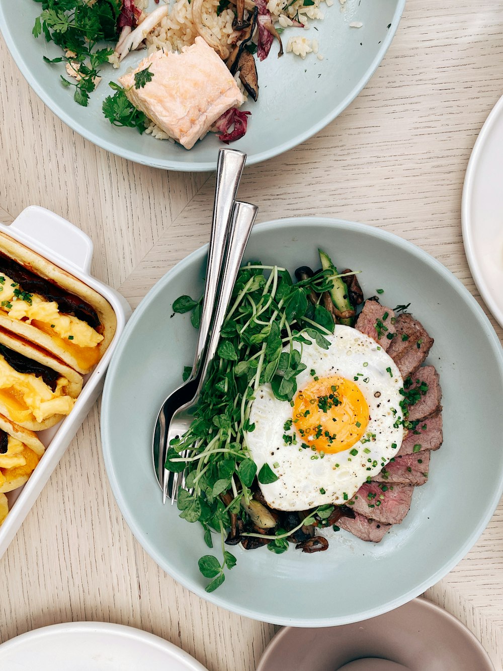 egg and vegetable salad on blue ceramic bowl