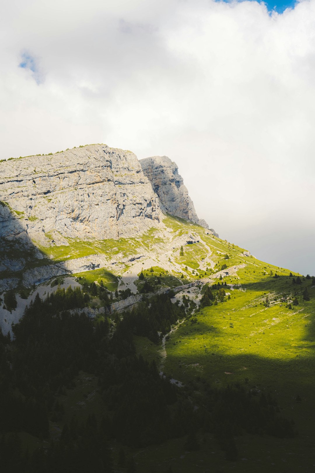 green and gray mountain under white sky during daytime