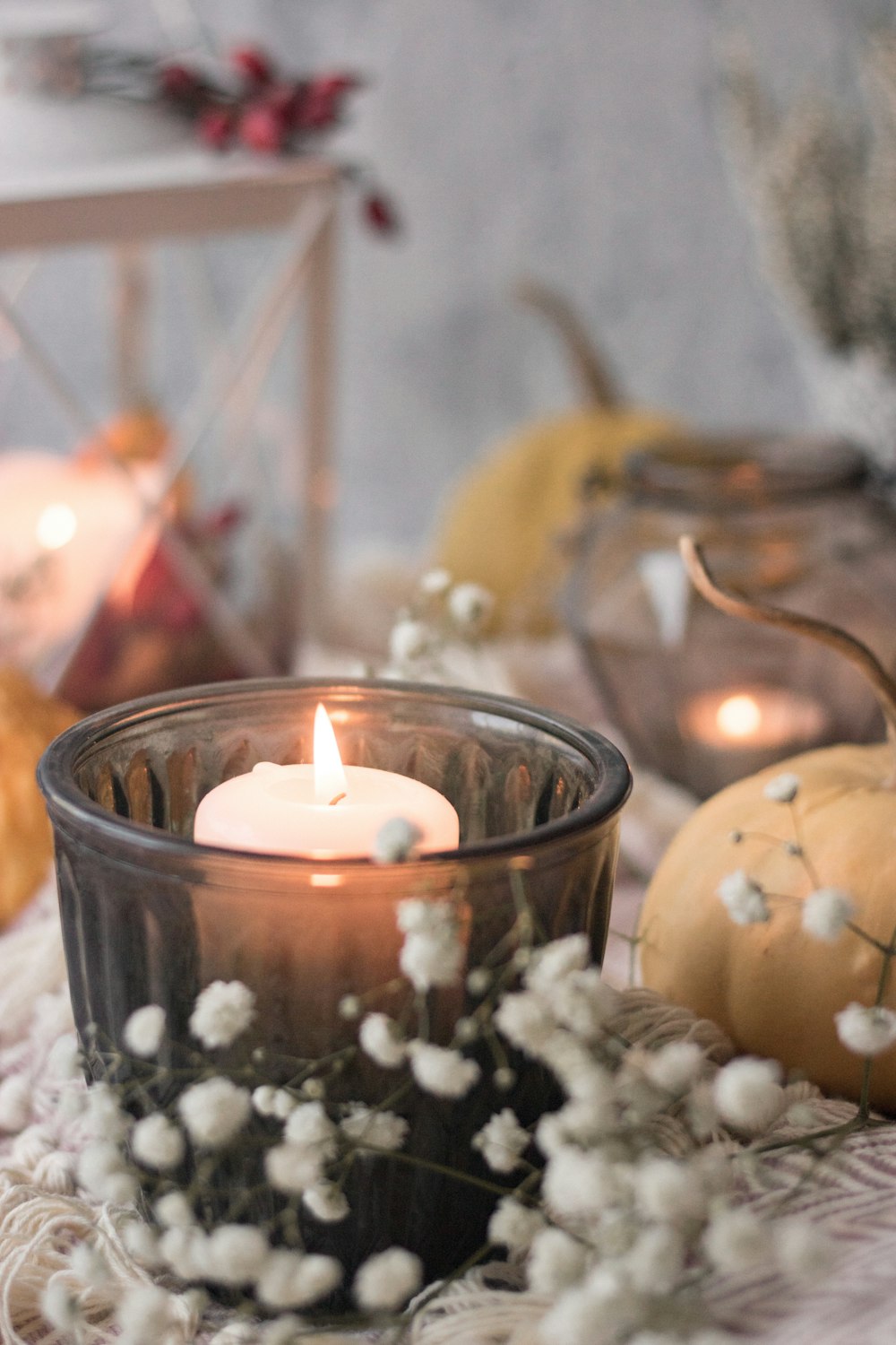 lighted candles on blue glass bowl