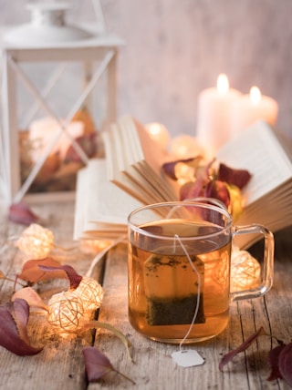 clear glass mug with brown liquid inside