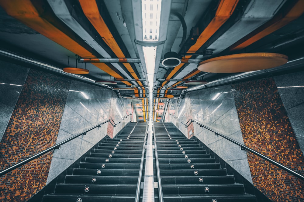 black and silver escalator in a train station