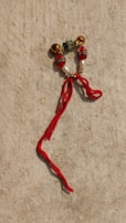 Colorful beads and shells used in traditional divination rituals on a cloth.