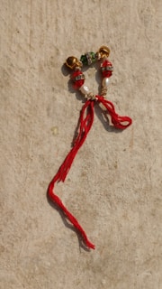 Colorful beads and shells used in traditional divination rituals on a cloth.