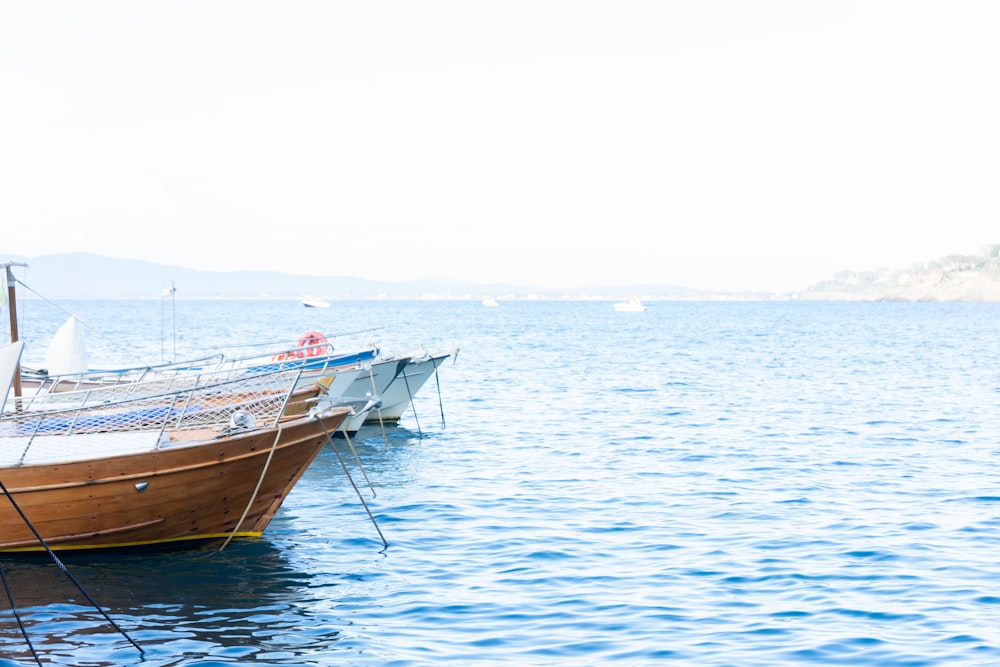 brown boat on body of water during daytime