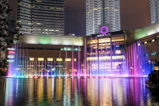 city skyline during night time in KLCC Park Malaysia