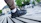 Close-up of casual klans shoes on a wooden bench with urban background
