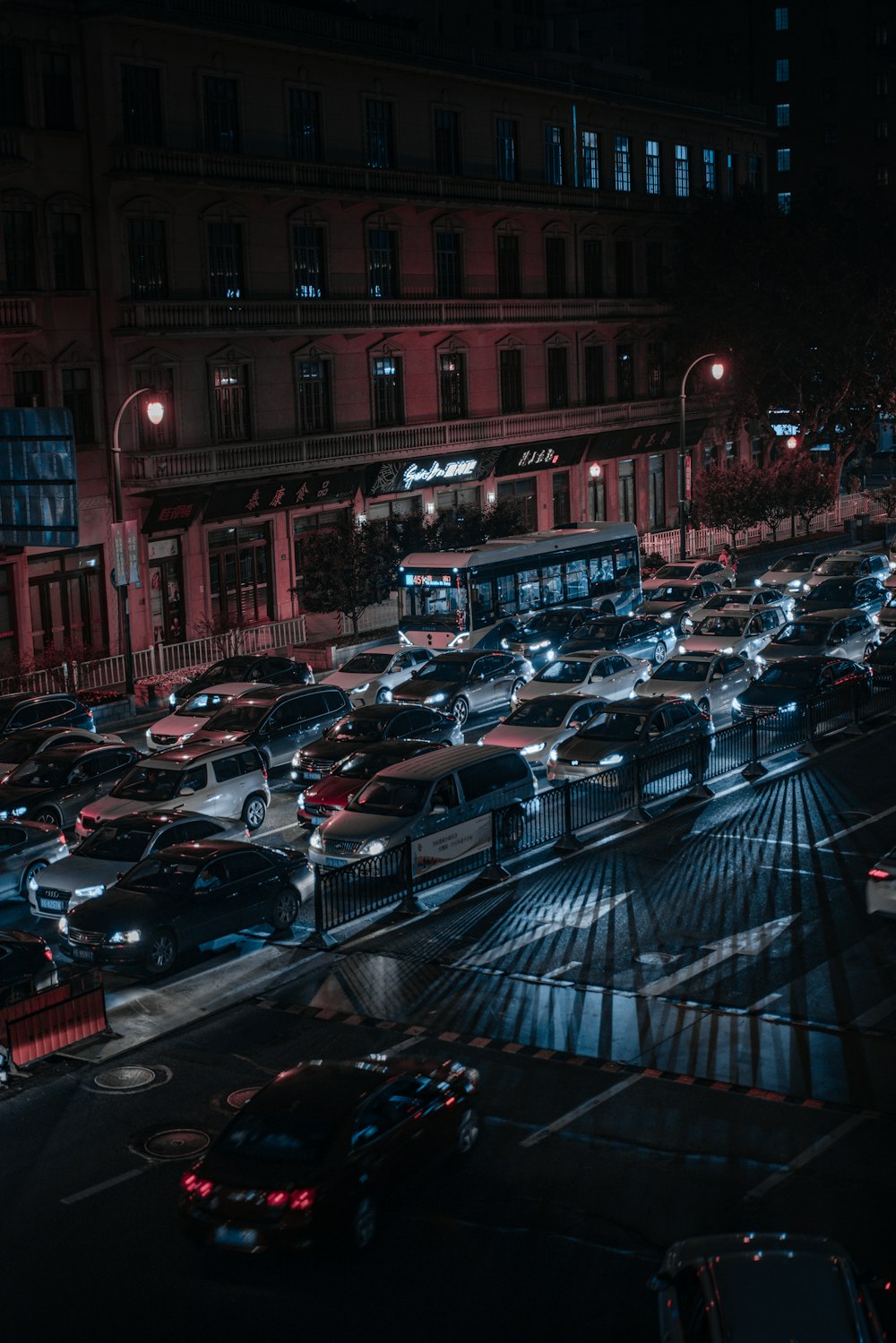 cars parked on parking lot near building during daytime