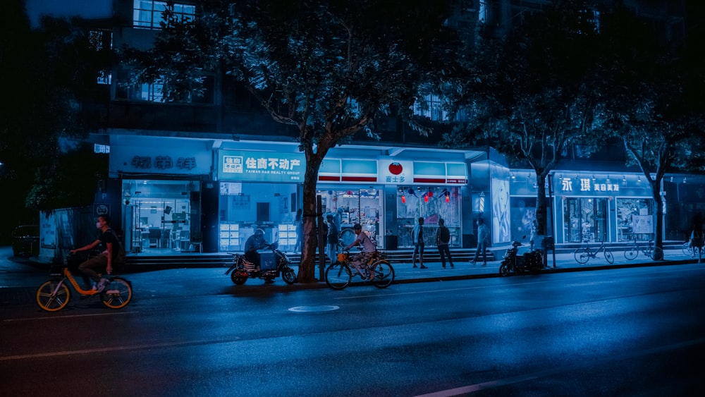 man in black jacket riding motorcycle on road during night time