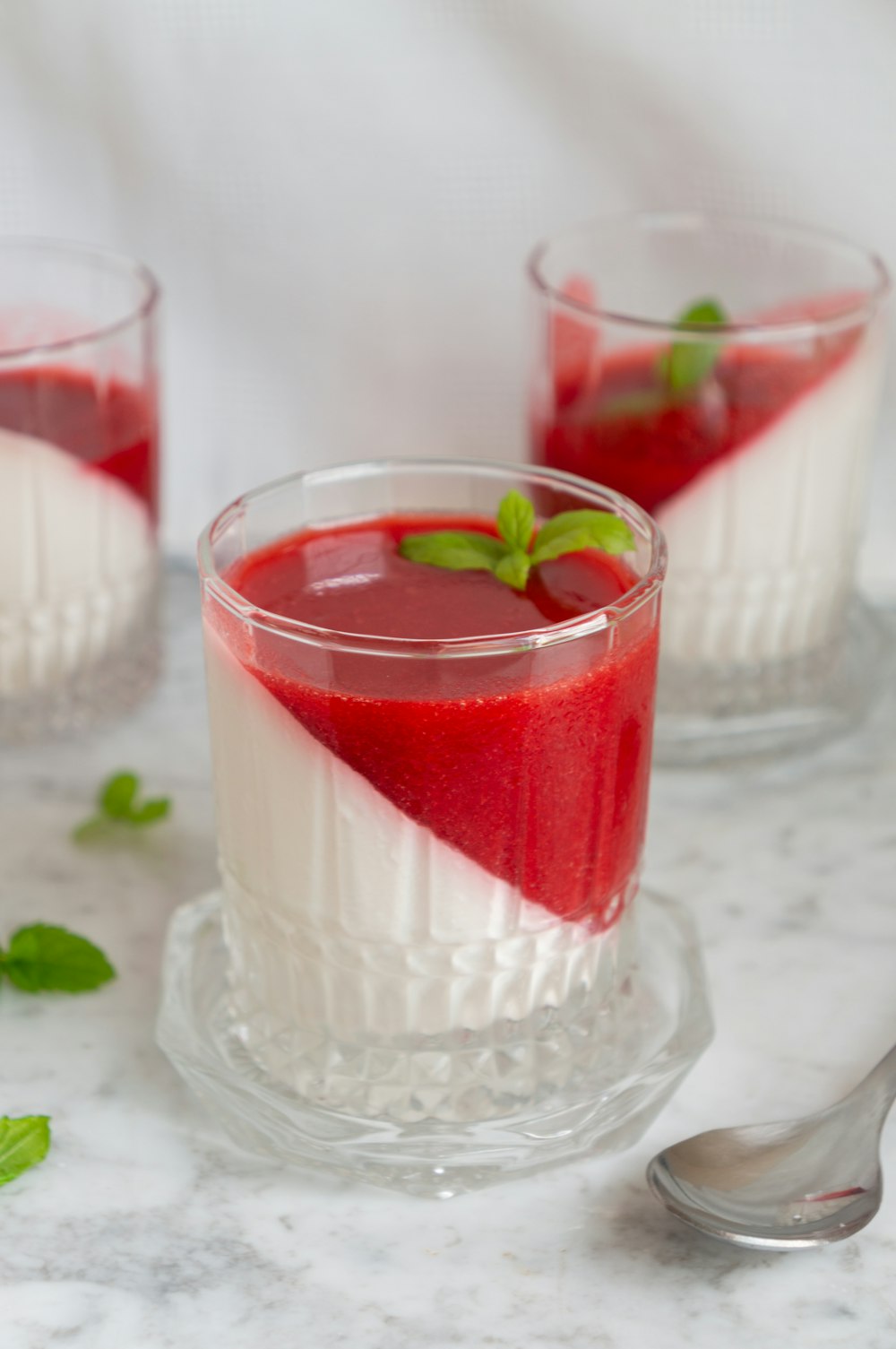 red and white liquid in clear drinking glass