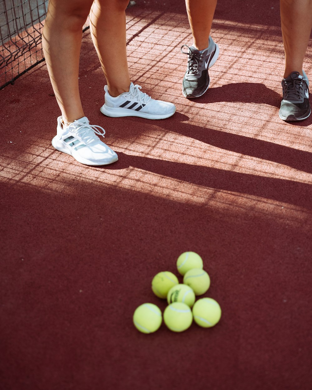 person wearing white nike athletic shoes