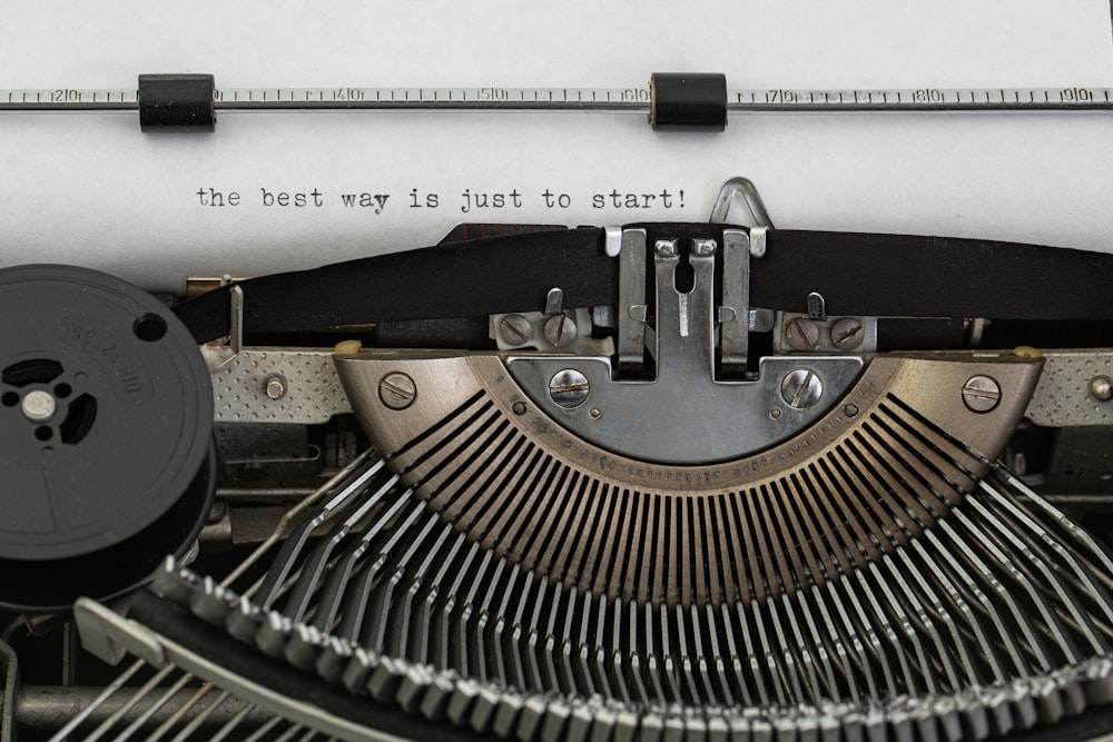 black and white typewriter on white table