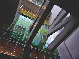 Modern industrial facility with emerald green and anthracite gray accents showcasing circular economy processes.