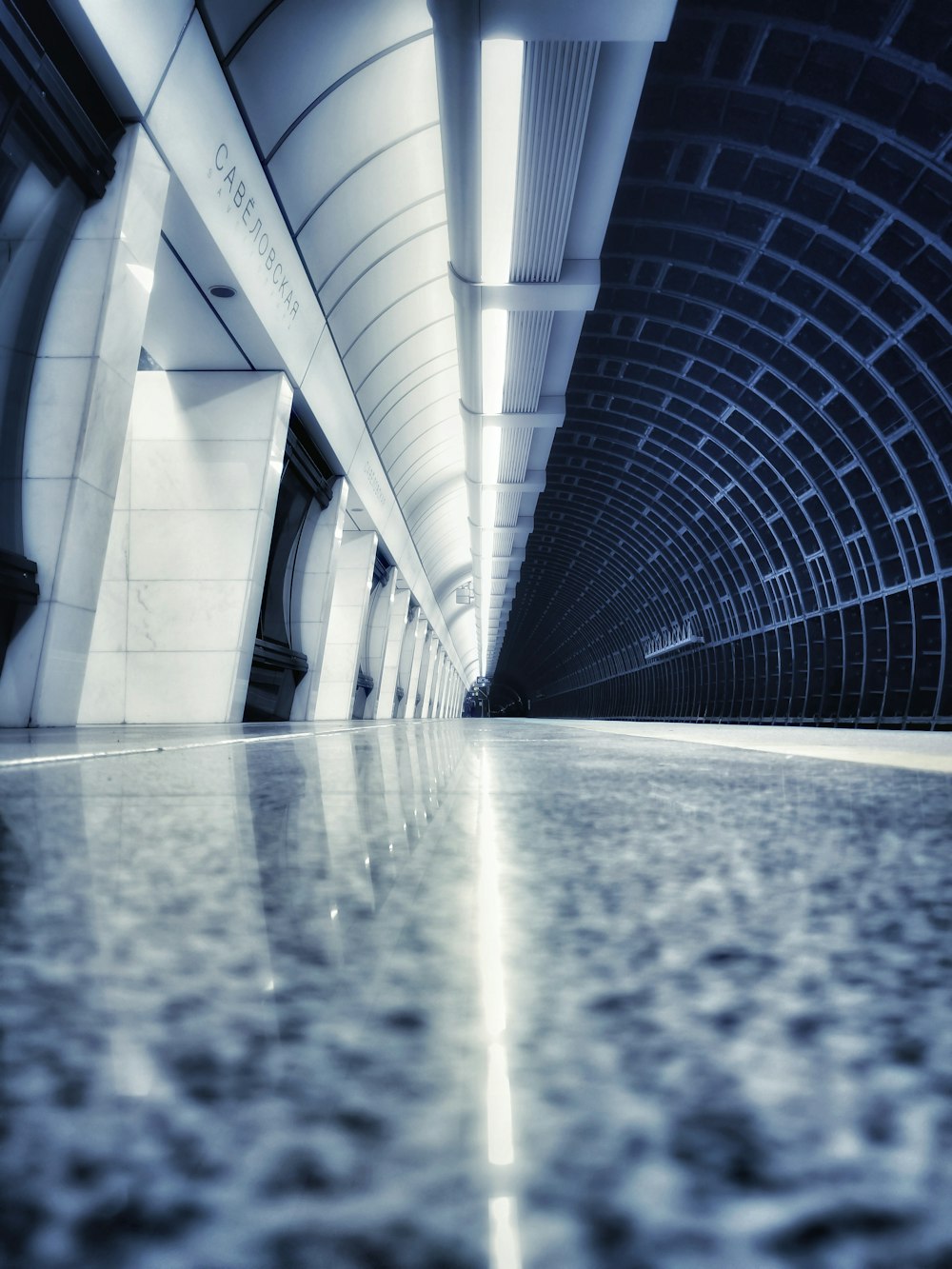 gray and white tunnel during daytime